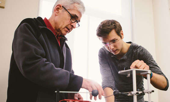 Physics professor and student in the lab.